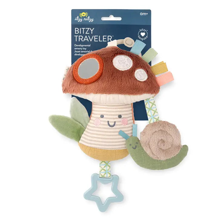 A soft stuffed toy featuring a mushroom and star, designed for exploration with various textures and sounds for infants.